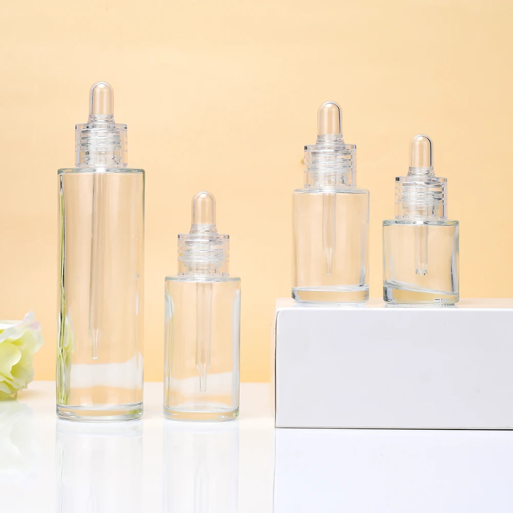 

70pcs 120ml 4 oz Flat Shoulder Hair Oil Bottle 30ml 50ml 60ml 100ml Cylinder Glass Essential Oil Bottle with Clear Dropper Cap