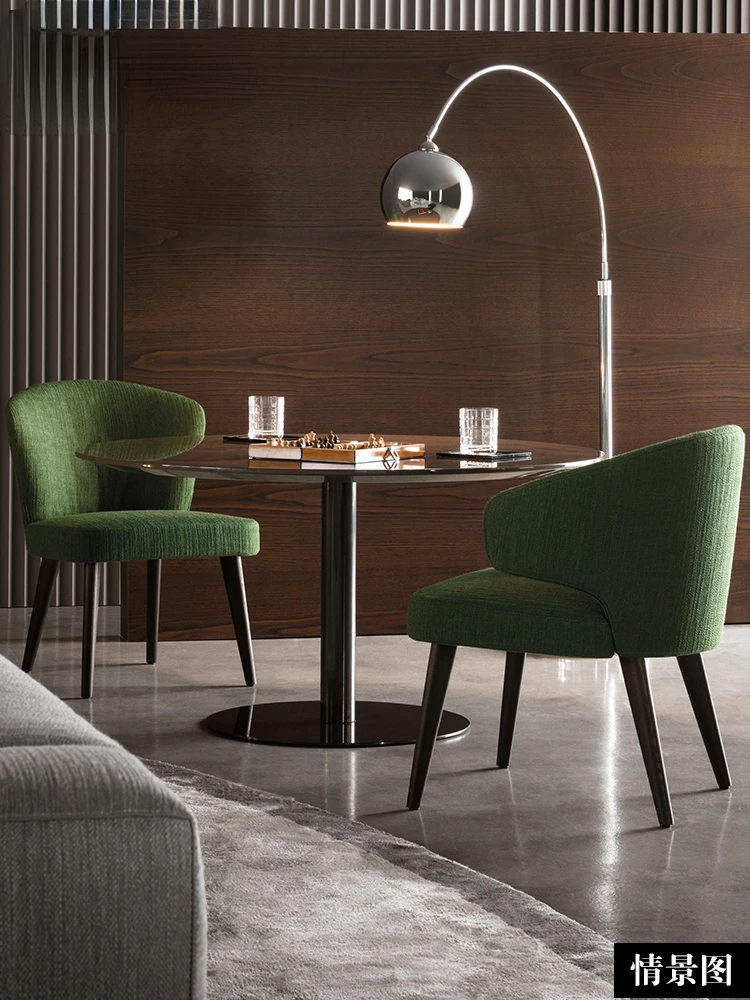 The Aston Dining Armchair is a simple, modern solid wood chair in fabric