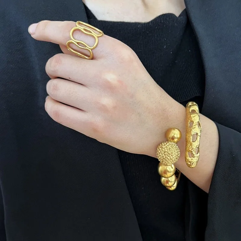 Hollow-textured spherical bangles for women spring ball vintage bangles elegant designer jewelry new in 2026