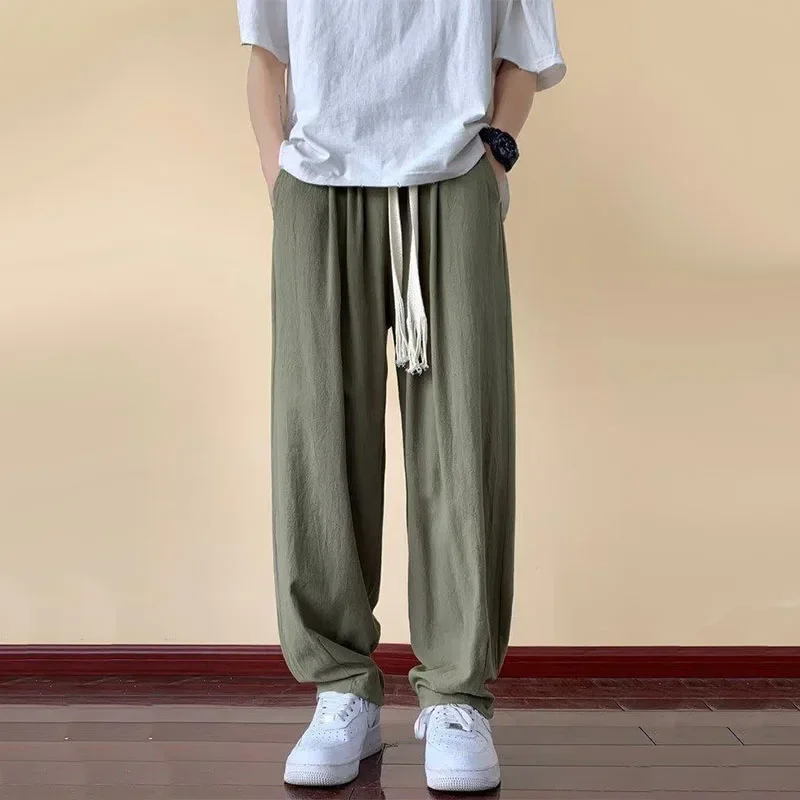 กางเกงฝ้ายลินินผู้ชายเอวยางยืดแบบบางระบายอากาศได้ดีกางเกงลำลองทรงหลวมสีพื้นกางเกงขาทรงกระบอก2024ฤดูใบไม้ผลิฤดูร้อน