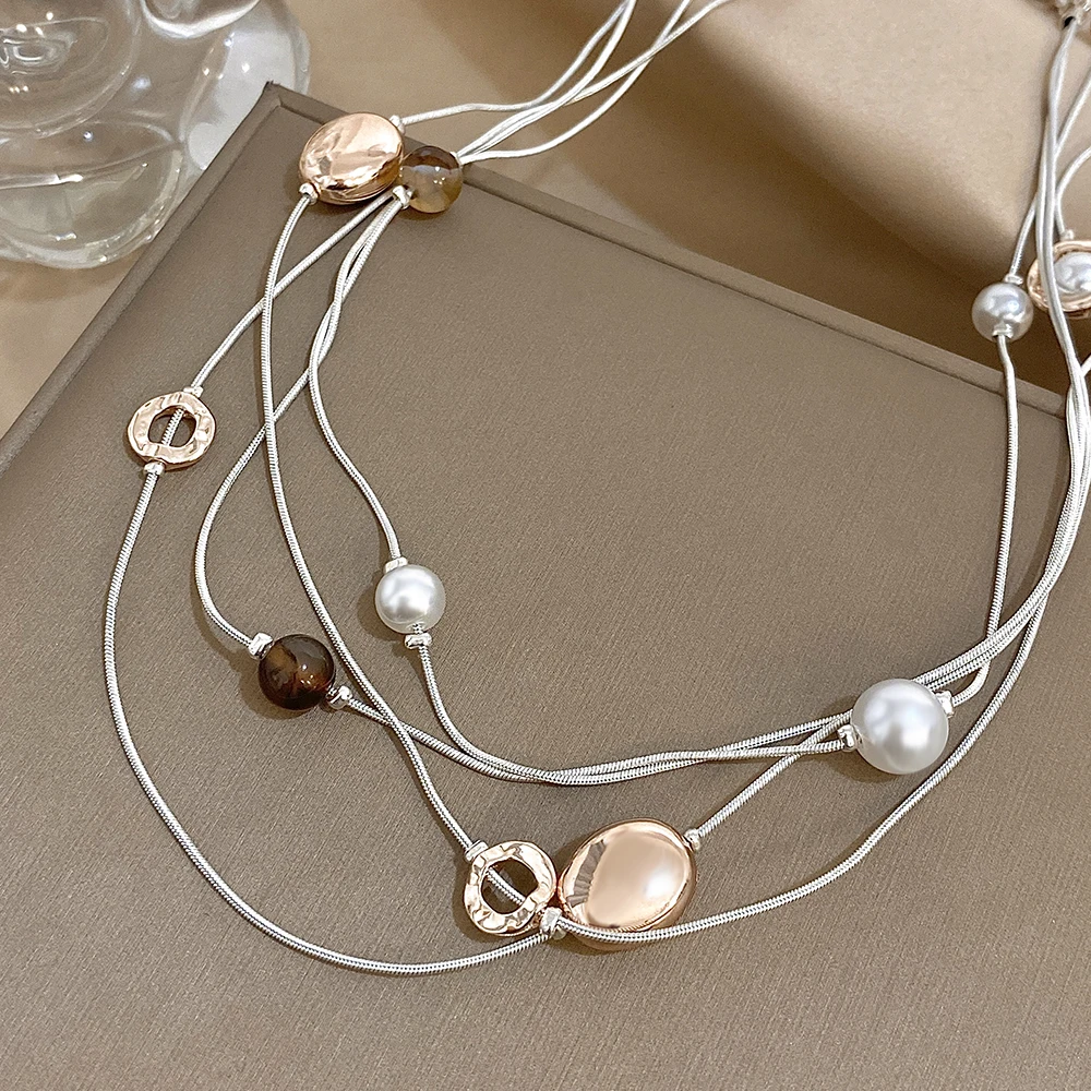 

Amorcome Minimalist Silver Color Layered Snake Bone Long Necklaces for Women Artificial Pearl Sweater Necklace Fashion Jewelry