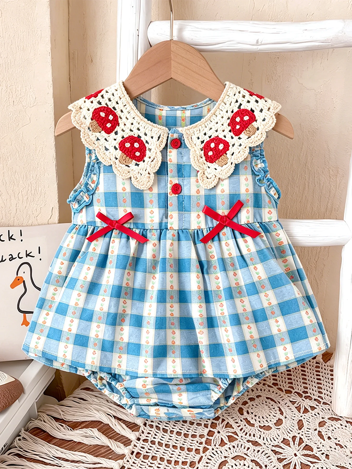 Crocheted Blue-and-White Checkered Sleeveless Rompers with Mushroom Collar and Bow for Baby Girls—Spring/Summer Style