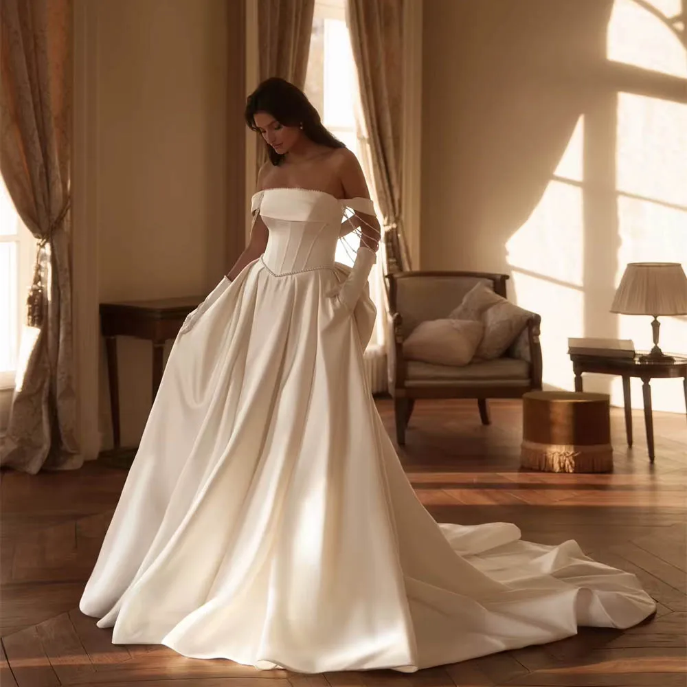 فستان زفاف رائع من الساتان الأبيض مخصص بدون حمالات بفيونكة فيستدو دي نوفيا عالي الجودة بسحاب خلفي فستان زفاف #1