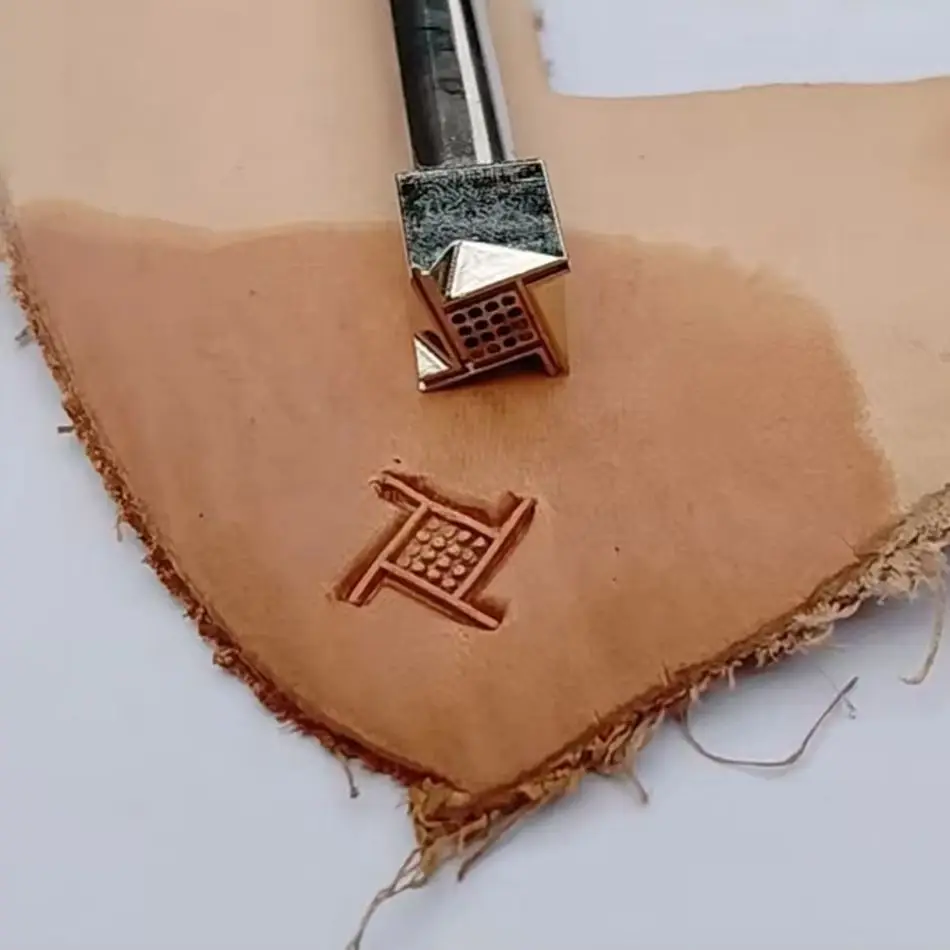Precision steel engraving and embossing functions for tools used in leather craftsmanship, featuring geometric grid patterns.