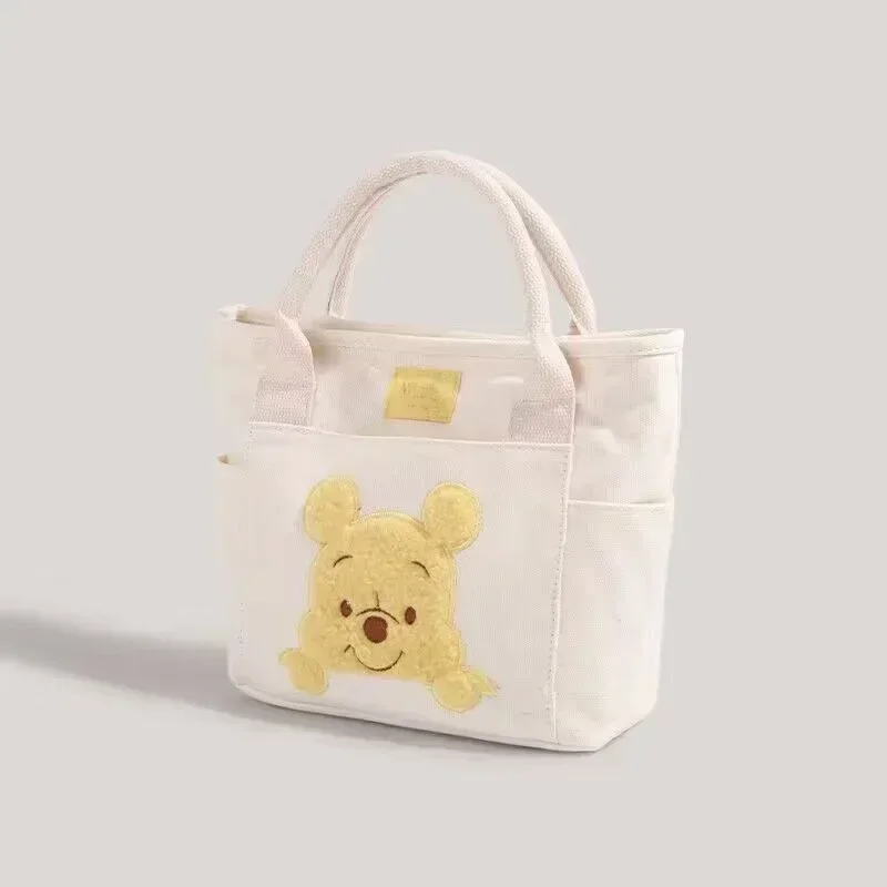 2024 New Disney Cute Cartoon Winnie the Pooh Canvas Crossbody Bag Doll Portable Handheld Crossbody Two-Purpose Bag