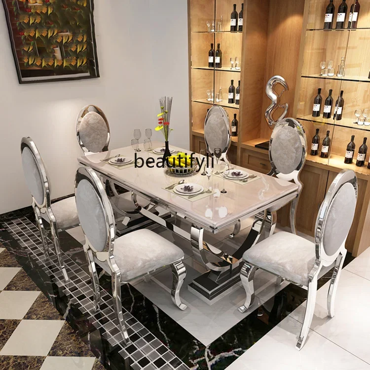 

A Modern light luxury marble dining table and chair combination, simple dining table, household stainless steel dining table