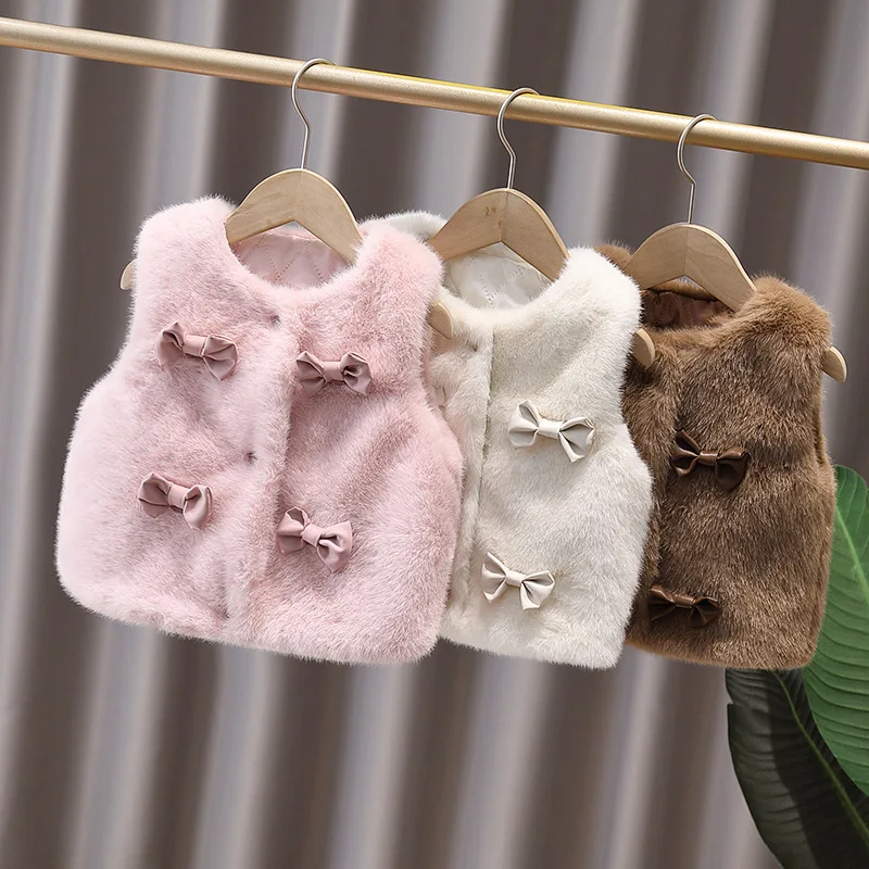 

Новая зимняя элитная пушистая куртка-жилет с цветком и корейской версией жилета с бантом на спине.