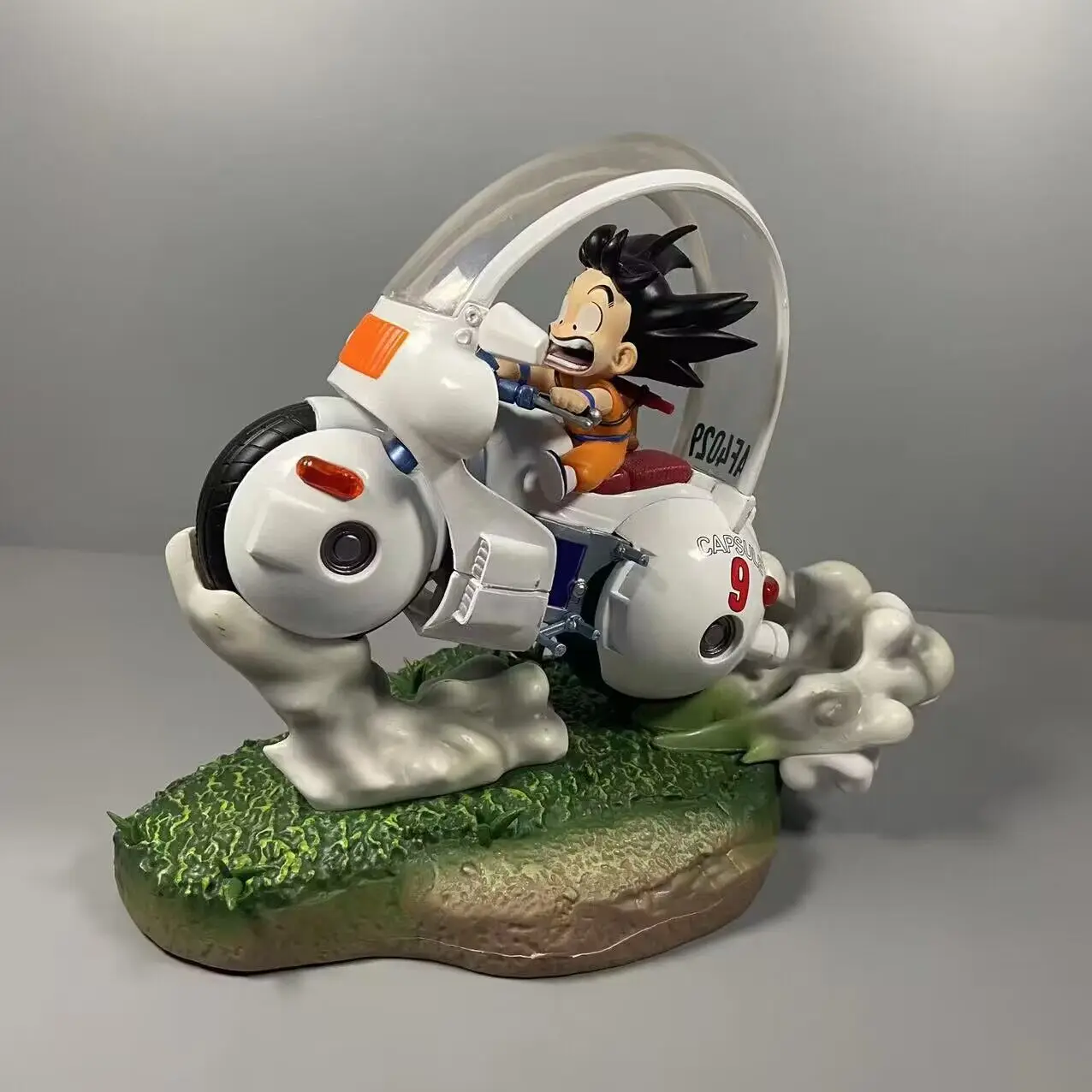 

Anime Dragon Ball childhood Goku riding a motorcycle Pvc Statue Model Toys Collectible Decoration Desktop Gifts.toy gift