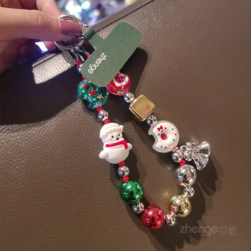 إكسسوارات رجل الثلج لعيد الميلاد، سلاسل الهاتف المحمول، زخارف المعصم الكرتونية، حافظات الهواتف النسائية، الحقائب، سلاسل المفاتيح، المعلقات