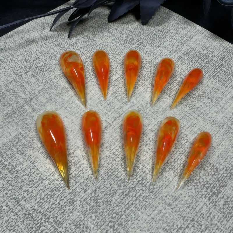 10PCS of semi-transparent gel orange and amber vortex-shaped fake nails, with smoky gradient long-pointed fake nails
