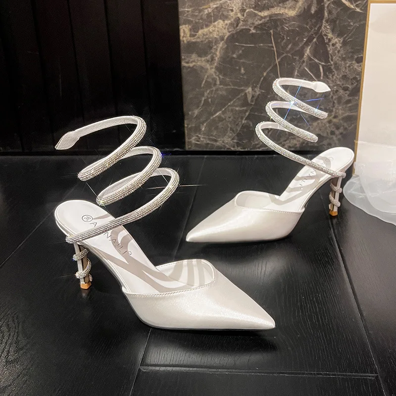 Baotou sandals for women in summer, sexy snake shaped wrapped rhinestone suede pointed high heels, white satin wedding shoes