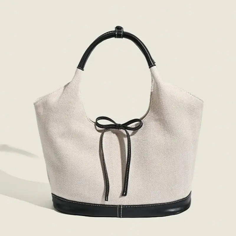 

Korean women's French niche bow tote bag with simple and versatile commuting shoulder bag, solid color casual large bag