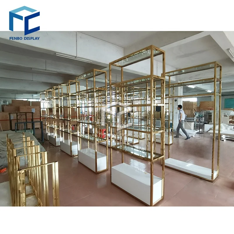 CustomHigh Quality Gold Display Shelf Furniture Stand Design for Garment Store Clothing Display Rack