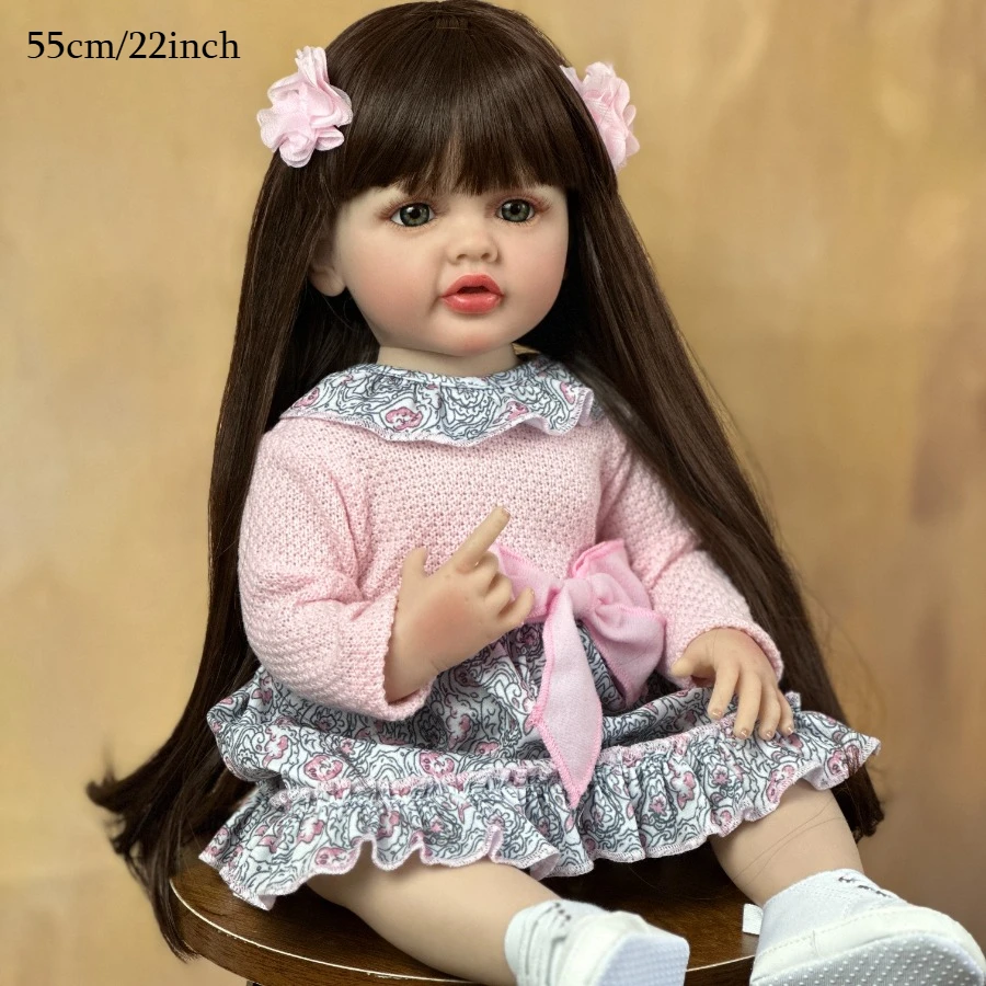 22 Inch Lifelike Reborn Girl Doll Long Dark Brown Hair Full Vinyl Body Pink Knitted Floral Skirt With Bow Hair Clips Can Bathe Kids Role Play Toy Birthday Christmas Gift