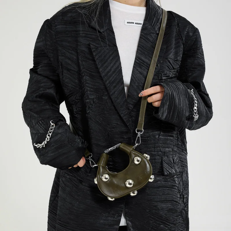 

Korean version of the fashion big rivets Ms. shoulder bag Yangqi mini dumpling bag 2025 new simple solid color handbag