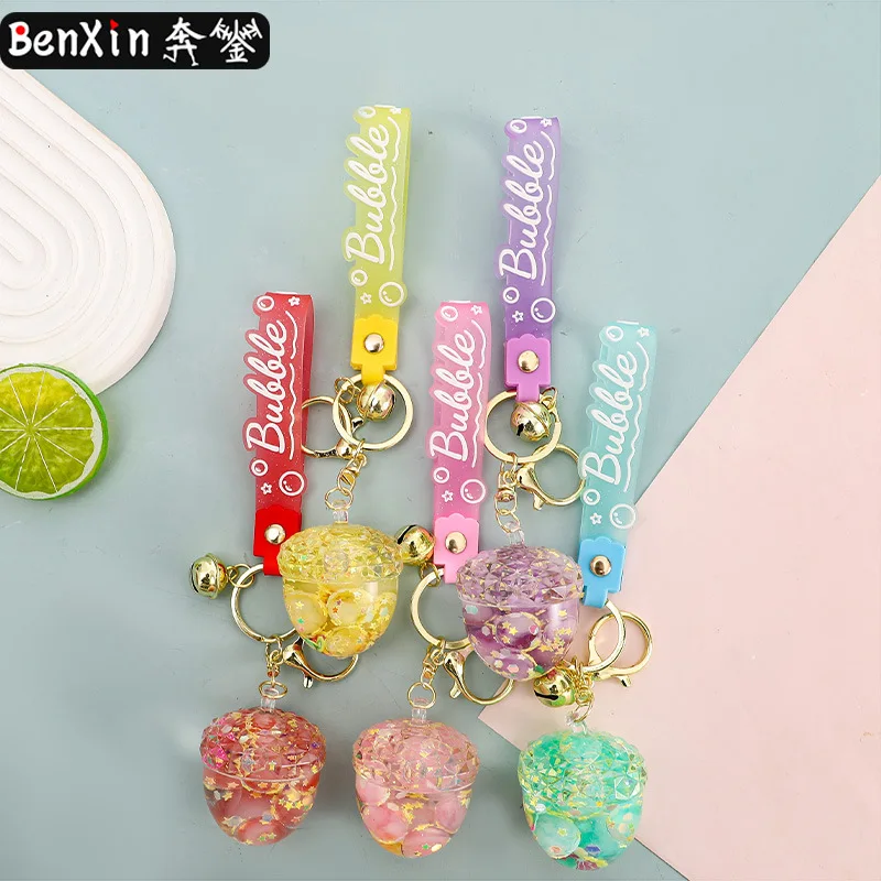 قلادة سيارة من سلسلة مفاتيح كوز الصنوبر المضيئة المشربة بالزيت من مينسو، زخرفة سلسلة مفاتيح رائعة على شكل حقيبة