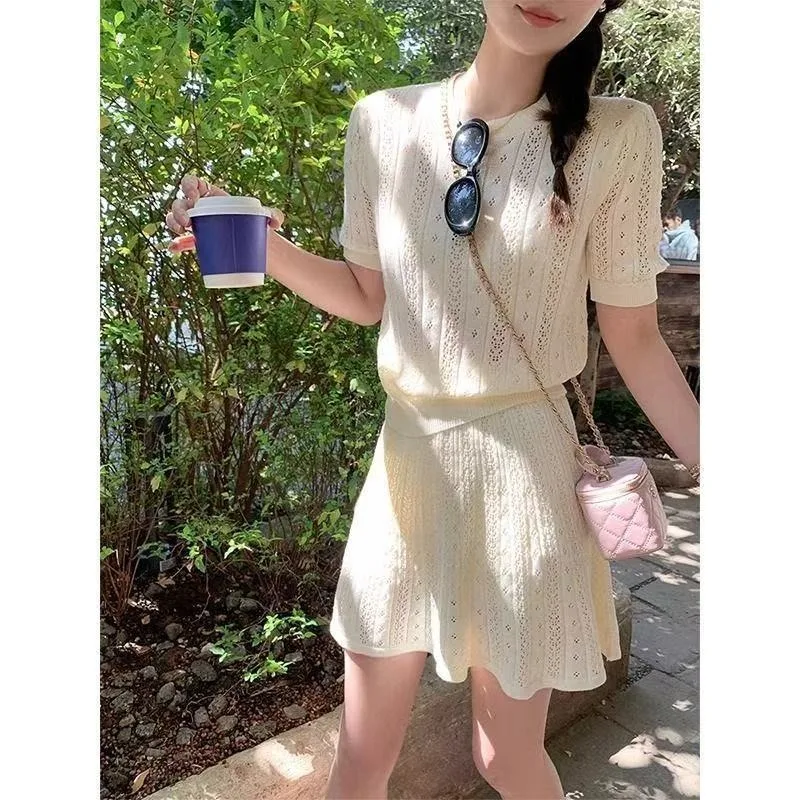 Elegance Featuring Short-sleeved Cut-out Short Tops Skirts Two-piece Set A New Summer Style Women's Knitted Skirt Set with Touch