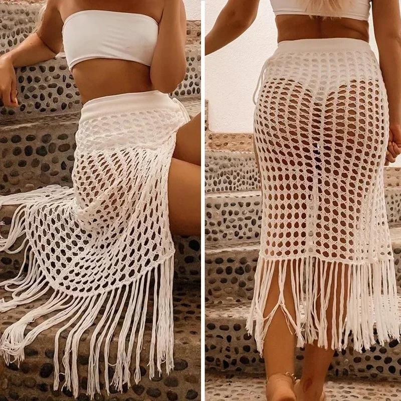 2021 spring and summer new European and American women's sexy see-through hollow knitted skirt split fringed beach skirt