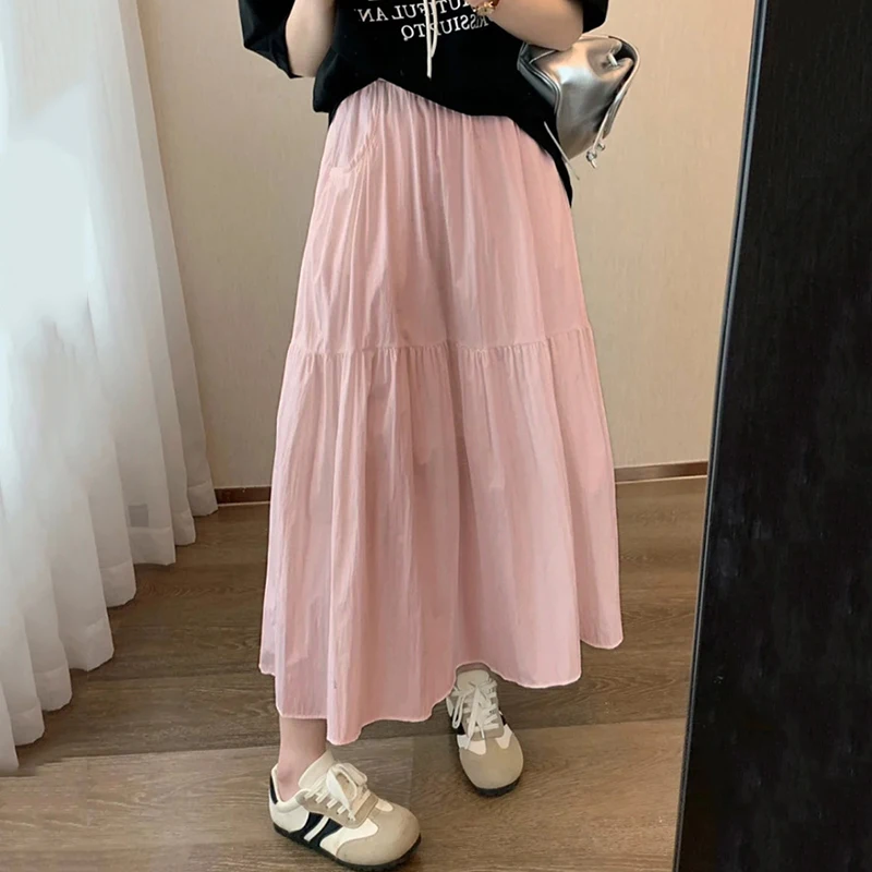 2025 Estate Bianco A Line Gonna Donna Moda coreana Elastico in vita Gonna lunga a pieghe Donna Tasca tinta unita Gonne medie Feamle