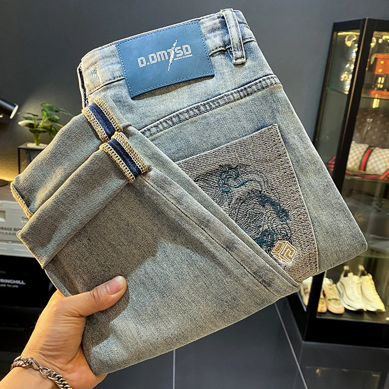 Fashionable high-end handsome jeans men's nine point 2025 summer thin embroidered slim fit trendy brand small foot casual pants