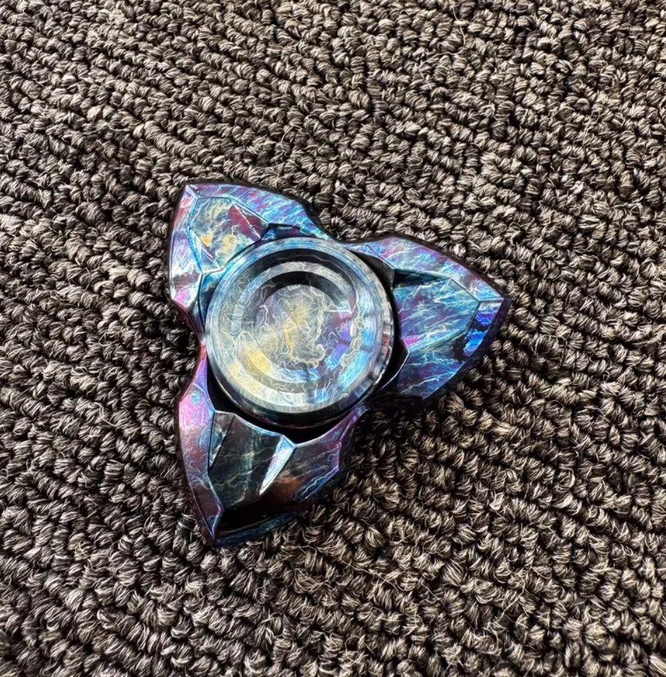 Used EDC Novo Storm Titanium Apache spinner fidget decompression toy