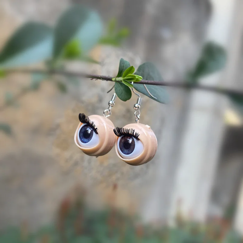 Awful creepy doll eyeball earrings with awful blinking action weirdos