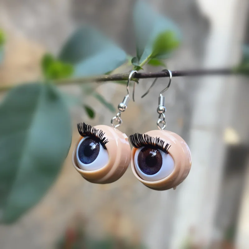 Awful creepy doll eyeball earrings with awful blinking action weirdos