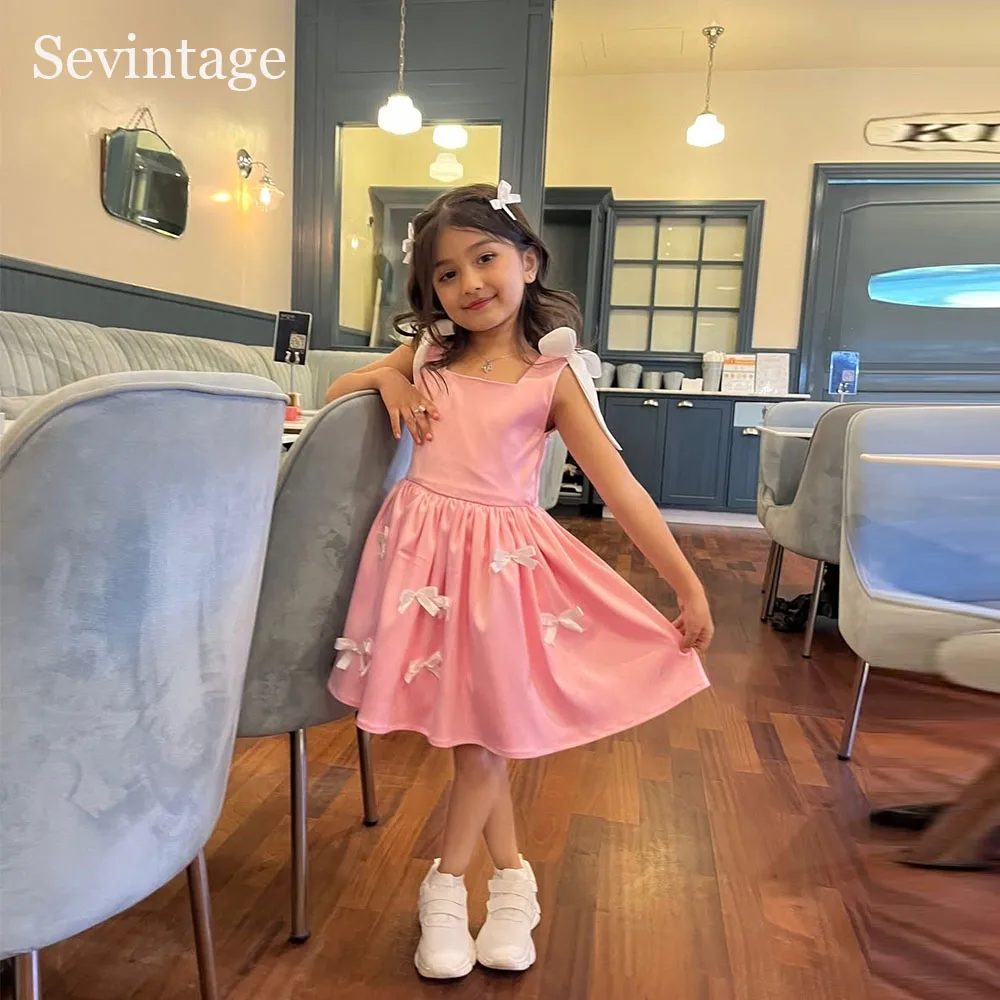 

Милые розовые платья для девочек Sevintage с цветочным узором, А-силуэт, без рукавов, с бантом, для дня рождения, длиной до колена, 2026, на заказ