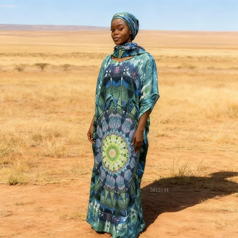 2026 Modieuze Afrikaanse vrouwen jurk rayon positionering hot boren afdrukken losse strand jumpsuit lange jurk groot formaat gewaad
