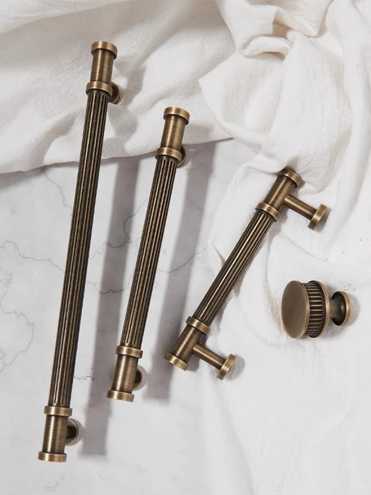 

Bronze colored Italian Roman columns, antique style wardrobe doors, brass handles, drawers, kitchen cabinets, French handles