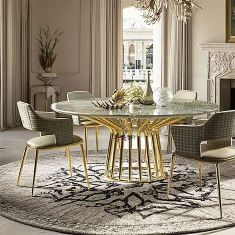 Mesa de comedor italiana y silla, combinación ligera de lujo, mesa redonda de mármol de alta gama, comedor moderno de acero inoxidable de alta gama para el hogar