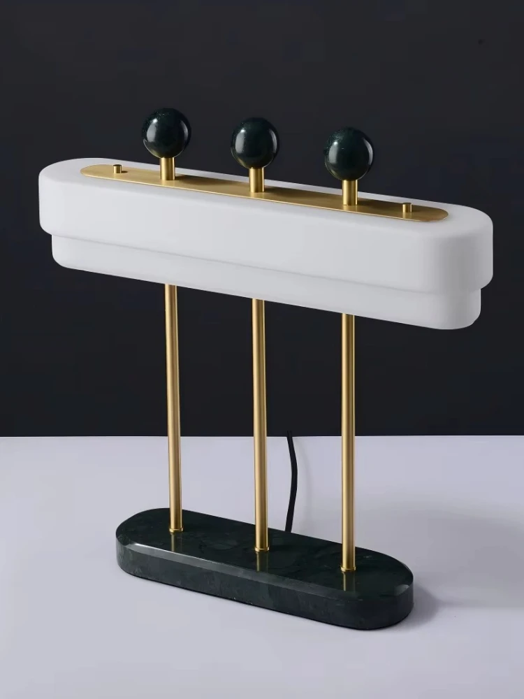Modern luxury living room and bedroom long table lamps with green marble frosted glass shades and brass LED sources