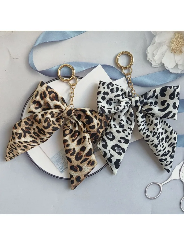 Porte-clés léopard coréen, organisateur avec nœud en ruban, porte-clés de voiture avec pompon suspendu, breloque de sac Anti-perte pour femmes et filles
