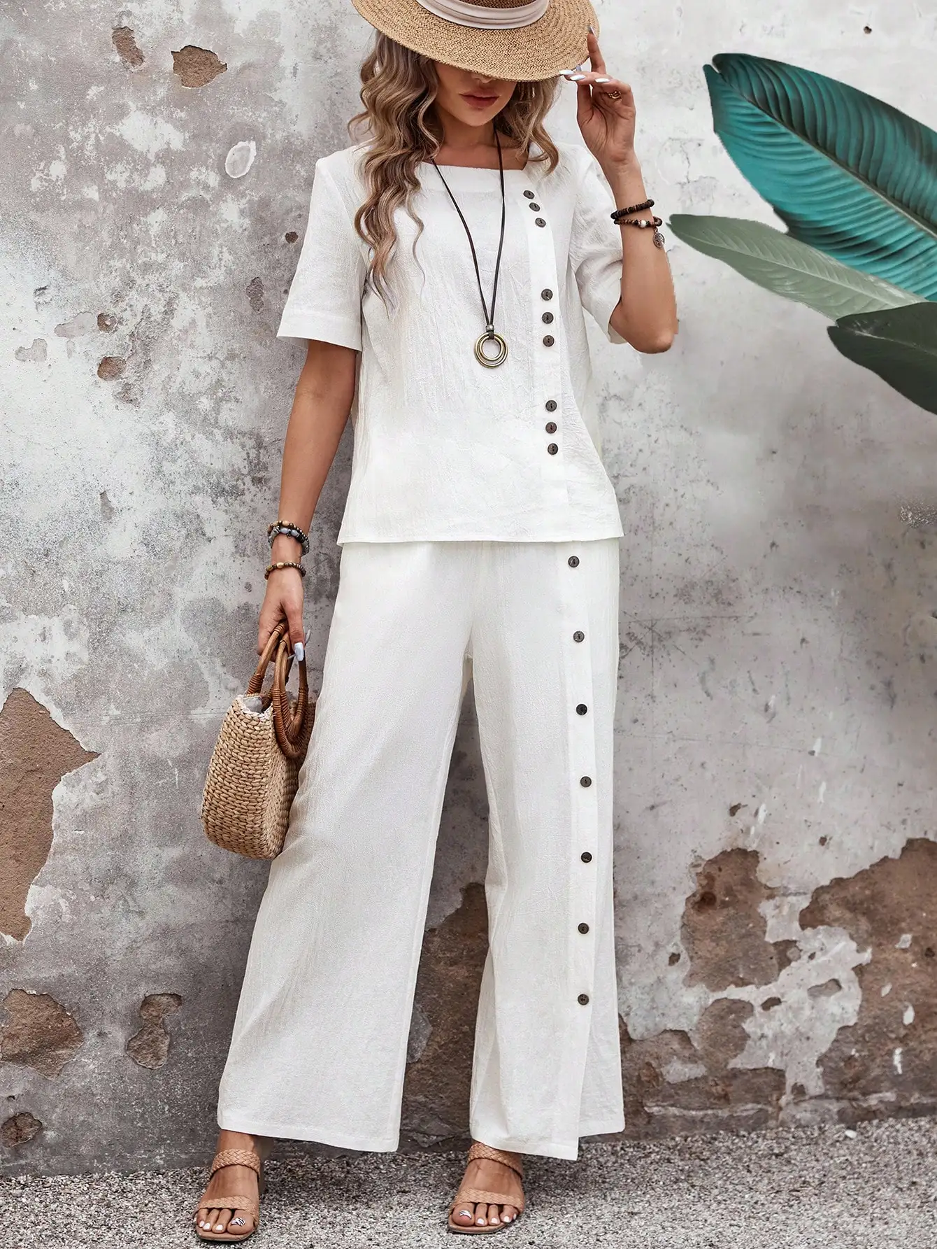 Abito con pantaloni larghi a gamba larga e top a maniche corte in cotone e lino tinta unita