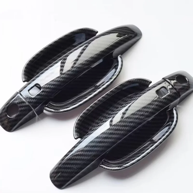 

Декоративная накладка из карбона для дверных ручек автомобилей Audi A4L, Q5L, A5 (модели 2017-2025 гг.), A1