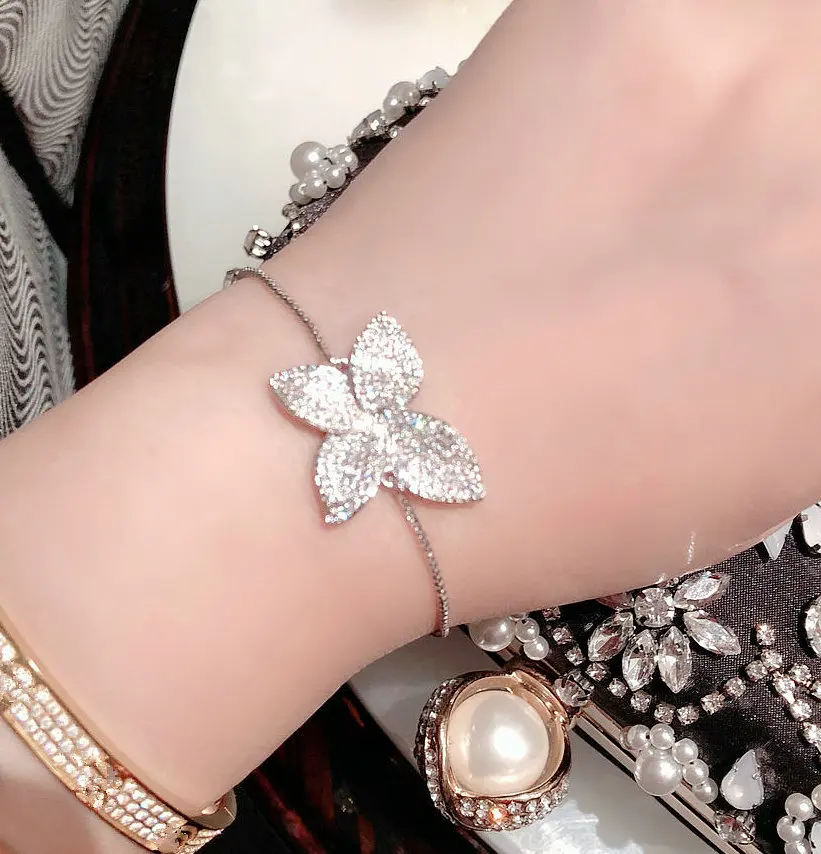 ZAKOL Fashion White Micro Paved Zirconia Crysyal Flower Adjustable Bracelet For Women Girl Bridal Wedding Party Jewelry FSBP2016