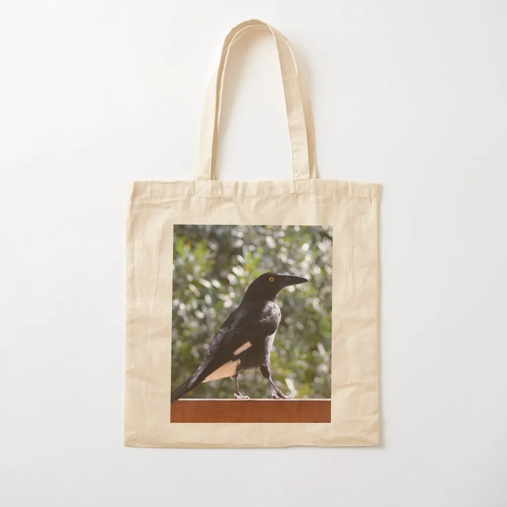 A currawong standing on a fence.A currawong standing on a fence. Tote Bag reusable shopping bag shopper bag woman