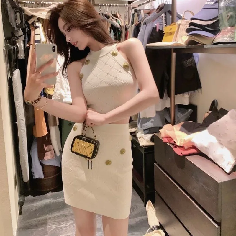 

Trendy Two-piece Set with A Thousand-gold Style Hollowed-out Sexy Metal Buttons Halter Top Cinched Waist and A Buttocks Skirt