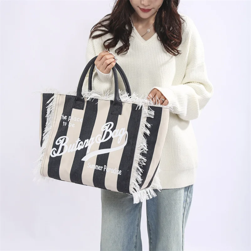 Popular Korean letters tassel canvas bag large-capacity bag simple commuting students to single shoulder Tote bag