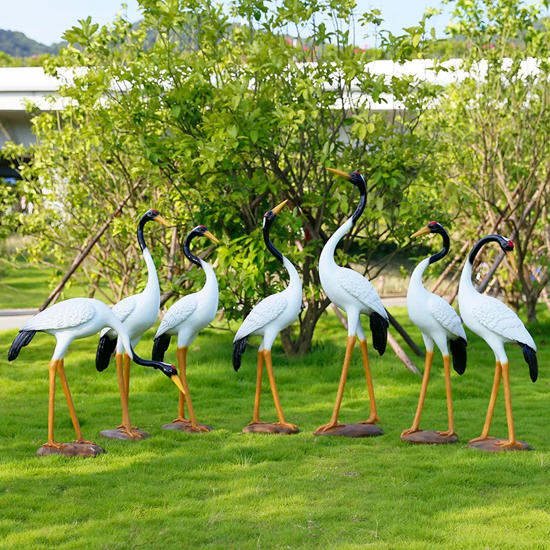 Outdoor simulation of red-crowned cranes, cranes, and fiberglass decorations. Animal sculpture park landscape, courtyard