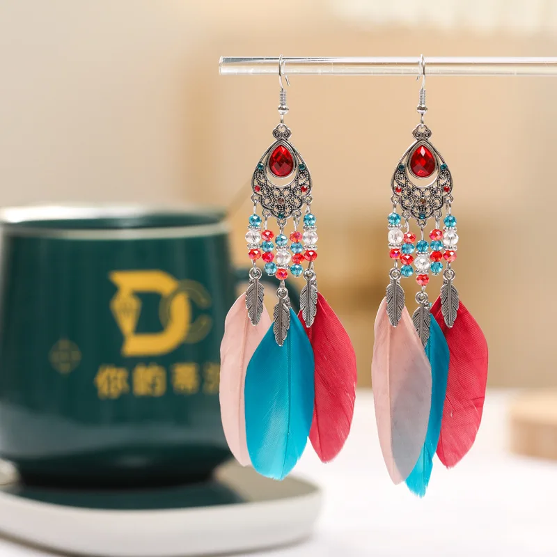 2026 الخاص بك Tixi البيضاوي مزاجه ريشة أقراط العرقية نمط كريستال أقراط Yunguichuan السفر المجوهرات بالجملة