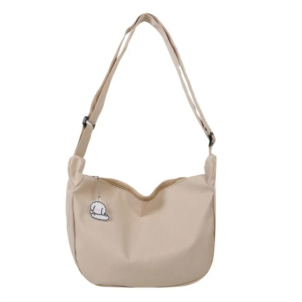 

Korean Style Lightweight Shoulder Bag Large Capacity Cream Color Canvas Bag with Pendant Solid Color Handbag Simple Dumpling Bag
