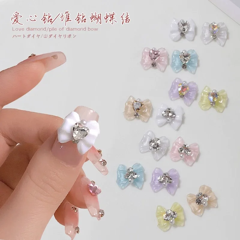 10 pçs 3d arco nó cristal coração diamante jóias prego broca marinheiro-beleza menina unhas encantos 14x12.5mm resina manicure acessórios