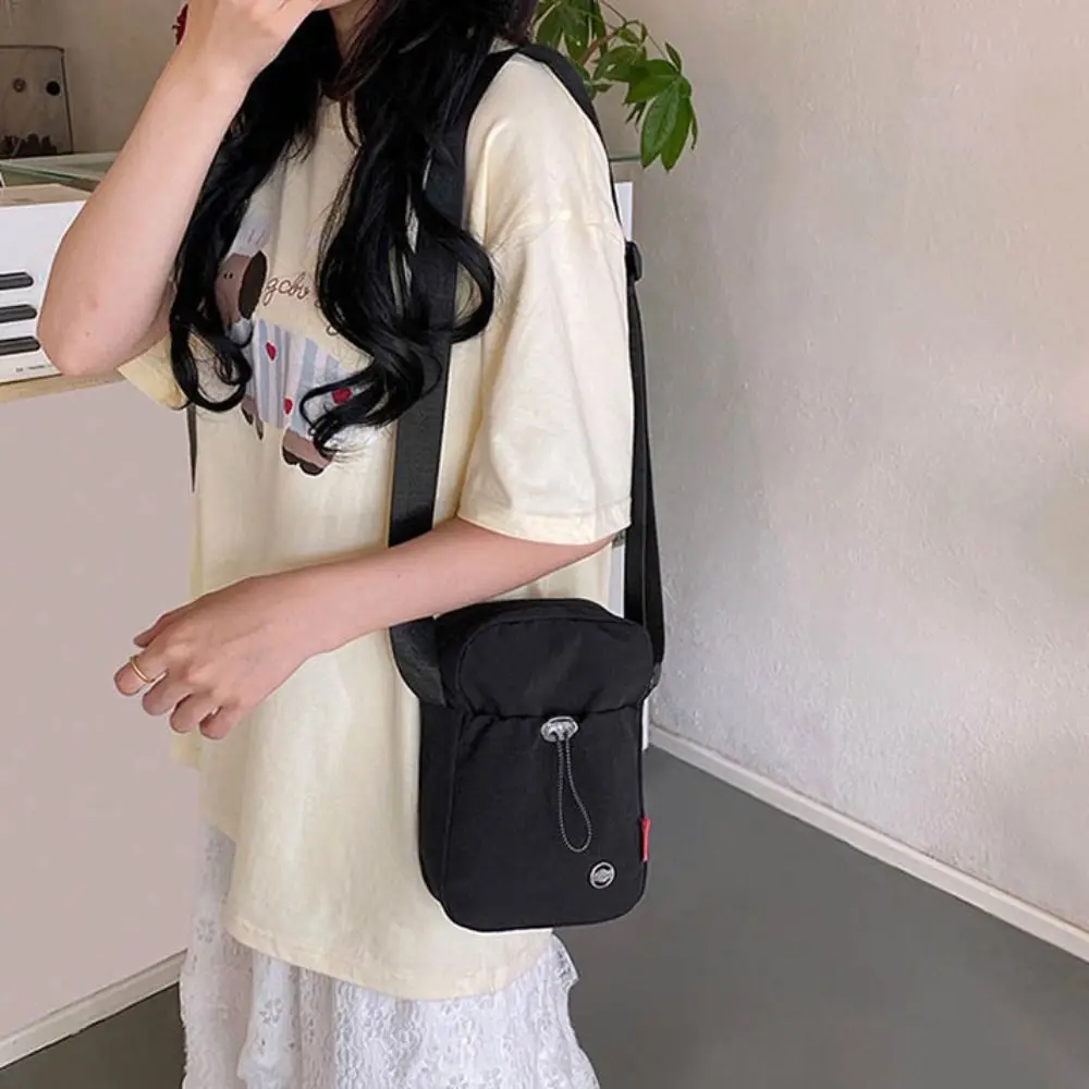 

Solid Color Drawstring Crossbody Bag Waterproof Korean style Water Bottle Carrier Bag Large Opening Nylon Mobile Phone Bag