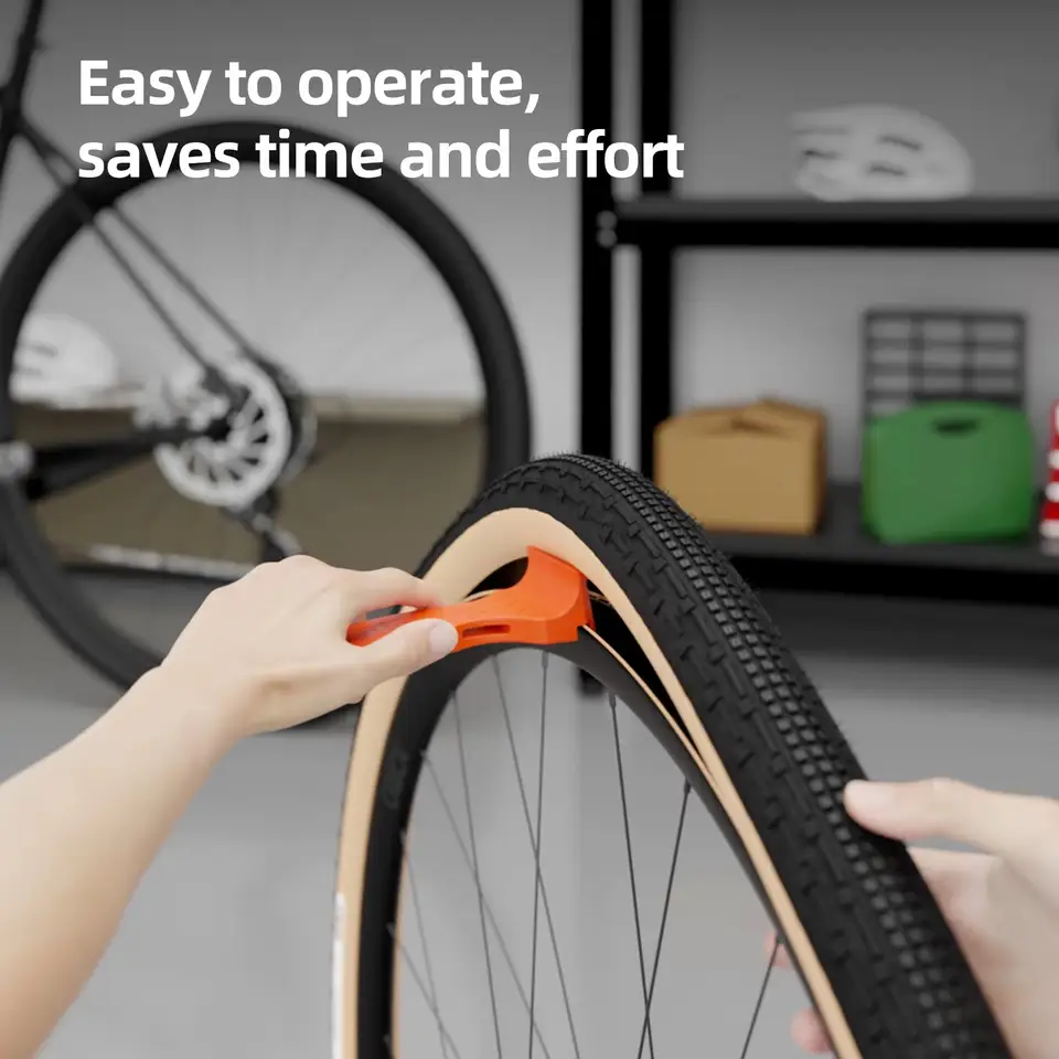 CYCLAMI Tire Lever prying a tire bead off a bicycle rim