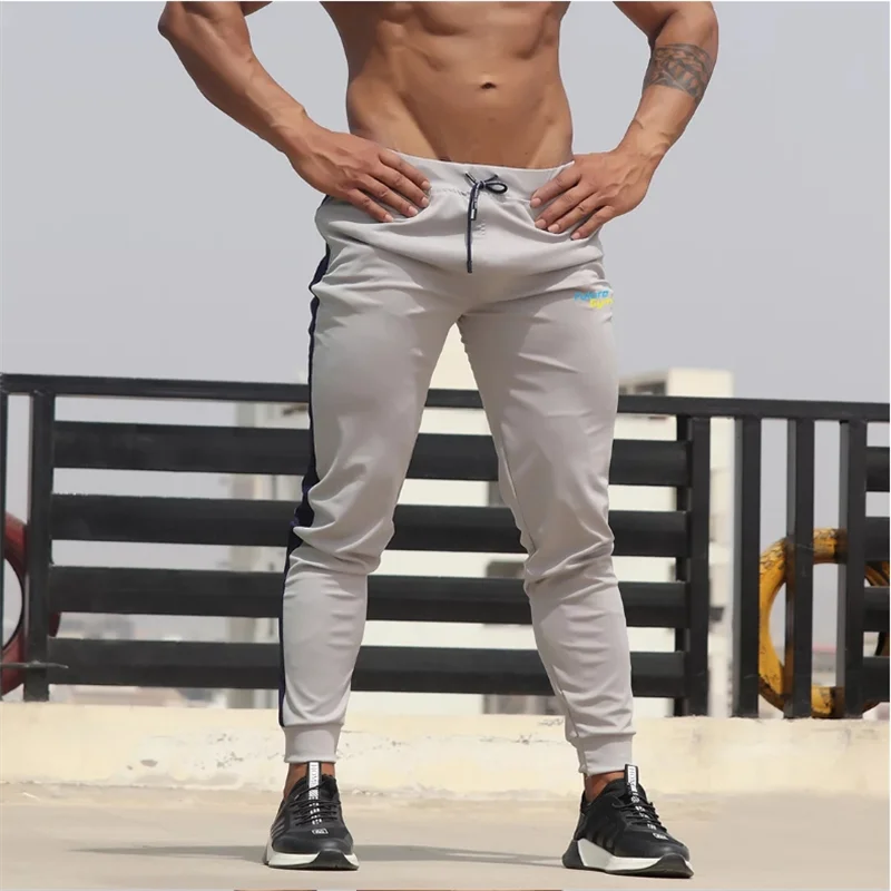 

Men's sweatshirt Jogging pants Men's casual pants Men's fashion color match zipper pocket pull rope sports tight pants small foo