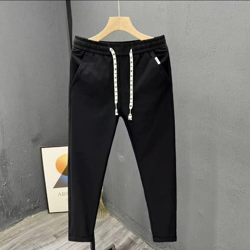 Calça masculina com harem elástica monocromática, bolsos altos, cordão com retalhos, comprimento do tornozelo que combina com tudo, moda verão