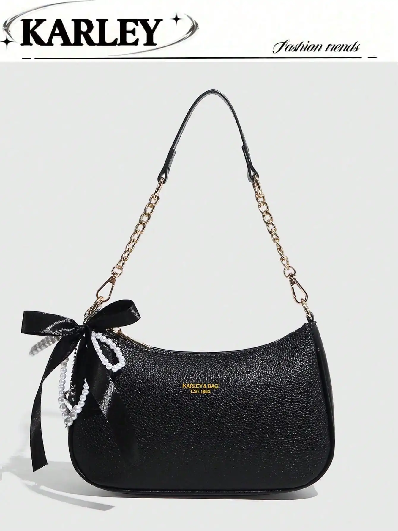 

Черная текстурированная сумка-полумесяц через плечо с золотой цепочкой и жемчужным бантом-подвеской