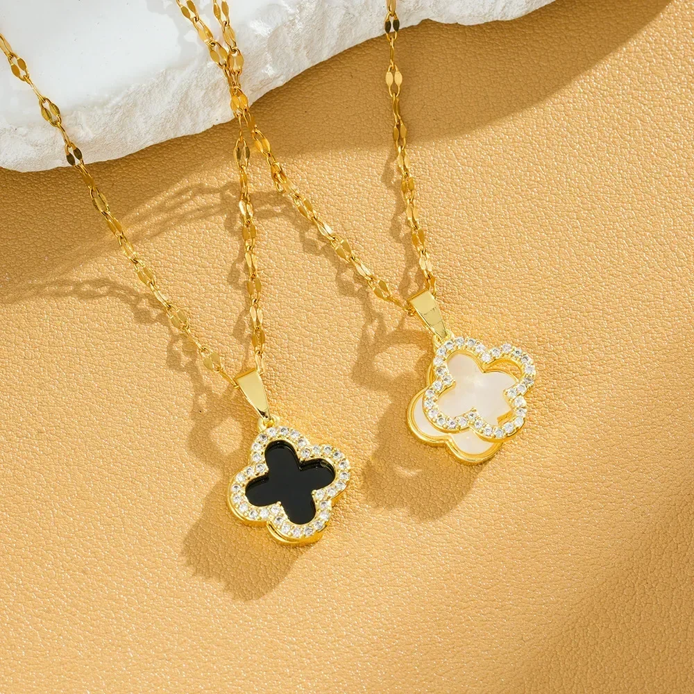 

9527A titanium steel necklace with a female hollowed-out design and slightly set with black and white four-leaf flowers