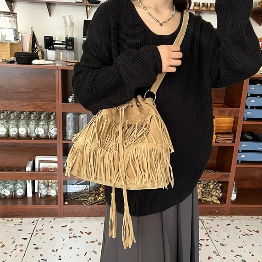 Korean Style Tassel Shoulder Bag PU Leather Large Capacity Suede Handbag Ethnic Style Solid Color Drawstring Bucket Bag Travel